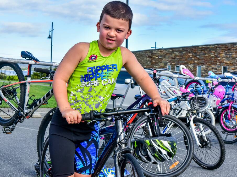 PEDAL POWER: Fletcher McCulloch, 8, gets into the spirit of the George Town Triathlon.
