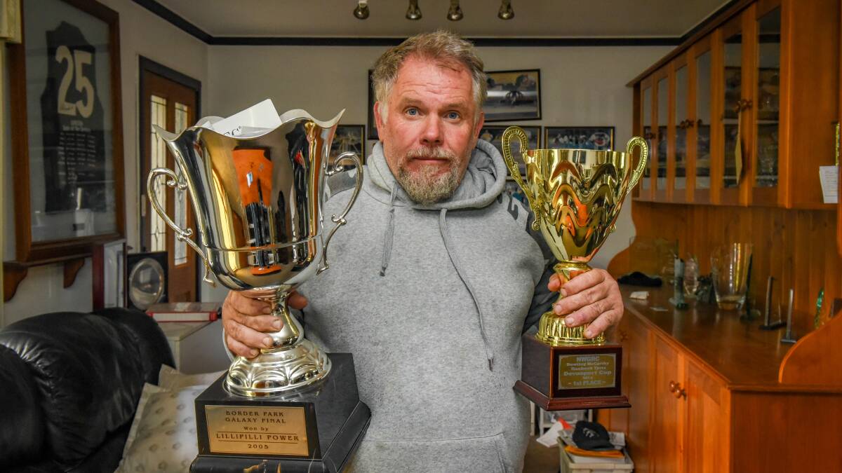 GOLD STANDARD: Bullock shows off his brief assortment of winning trophies from the track.