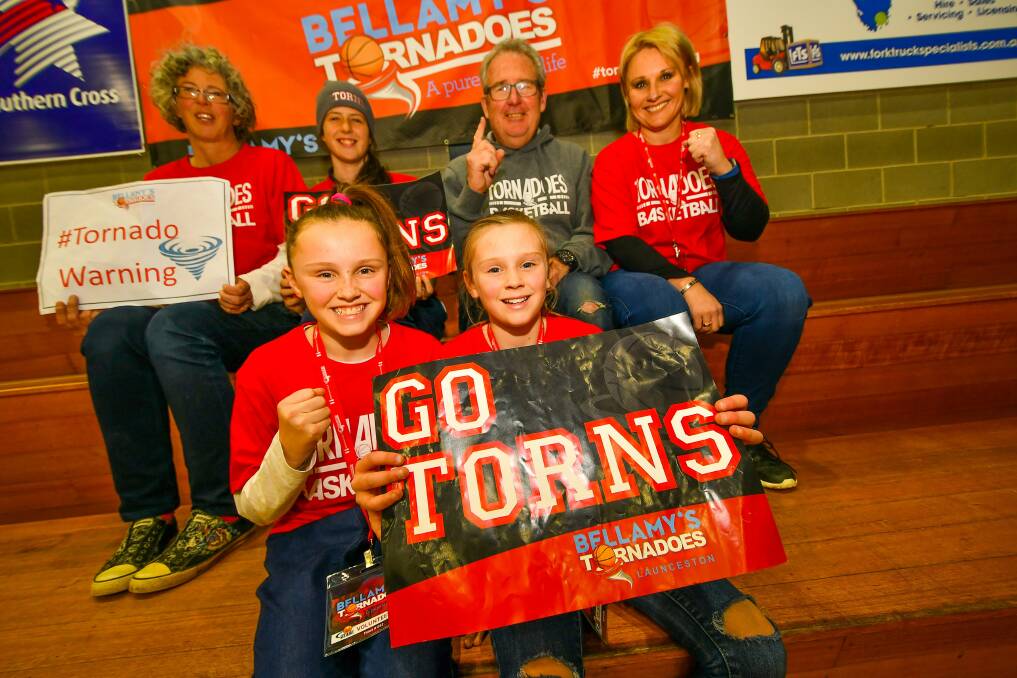 GO TEAM: Tornadoes supporters show their support at Thursday night practice.