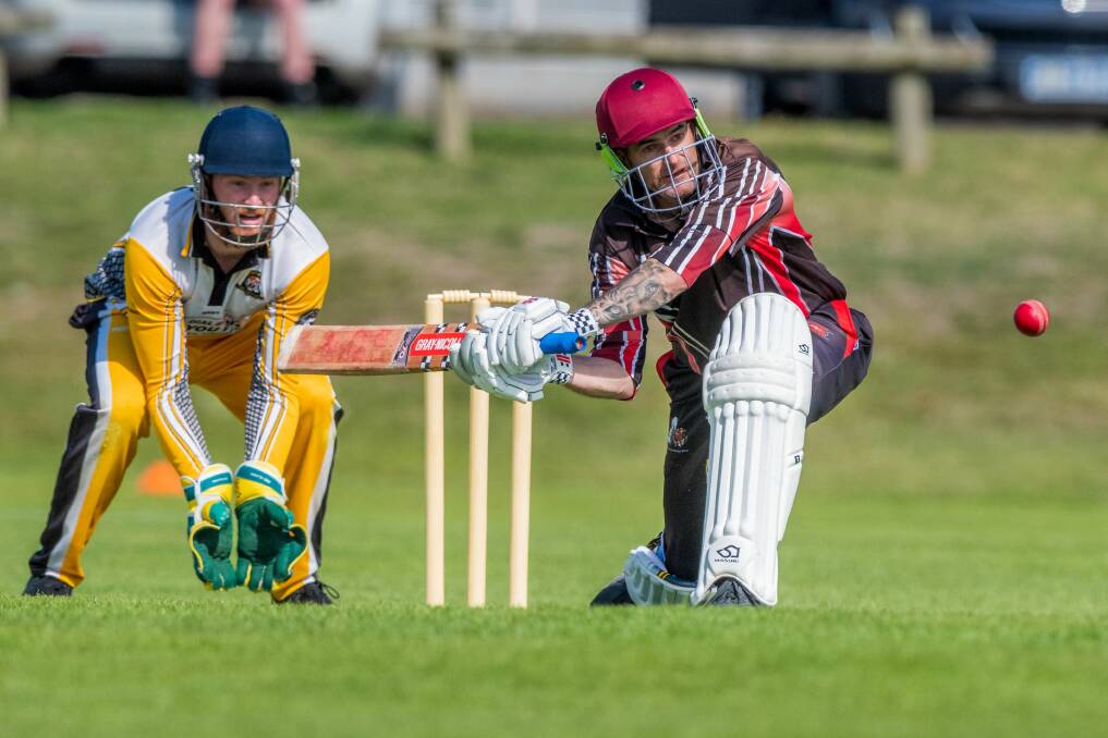CONCENTRATION: Hadspen hero Nathan Balym looks to sweep through the legside as Longford wicketkeeper Jackson Blair watches on during the TCL Premier League grand final on Saturday at University Oval. Picture: Phillip Biggs