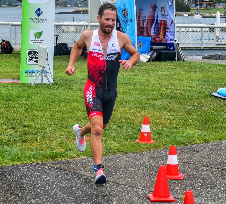 ON THE LONG RUN: Fast-finishing Mark Padgett burrows his way through the top of the field towards the line at the George Town Triathlon on Sunday. Pictures: Neil Richardson
