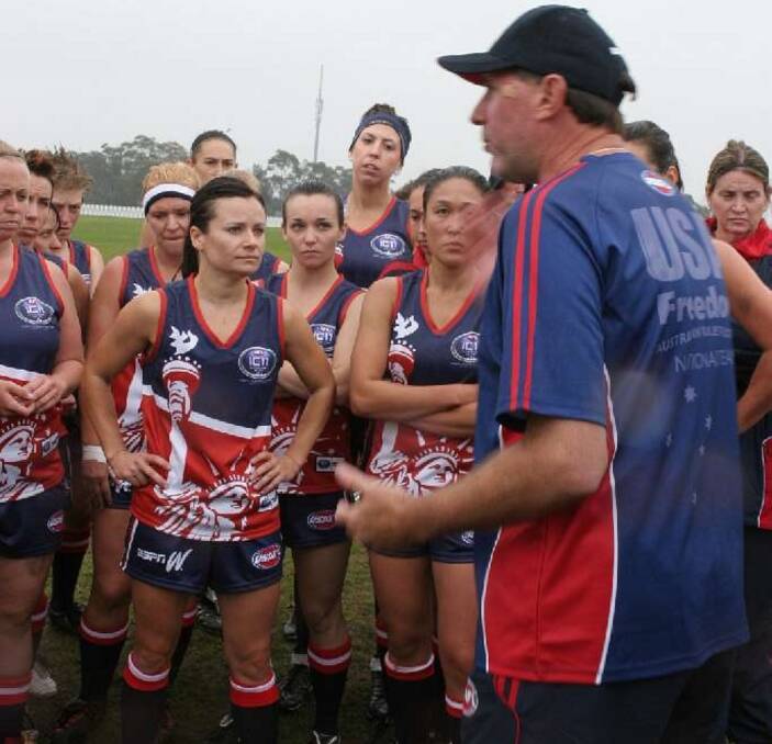 Barnes delivers an impassioned plea to his USA Freedom women's national side in the quarter-time huddle during the 2014 International Cup in Melbourne.