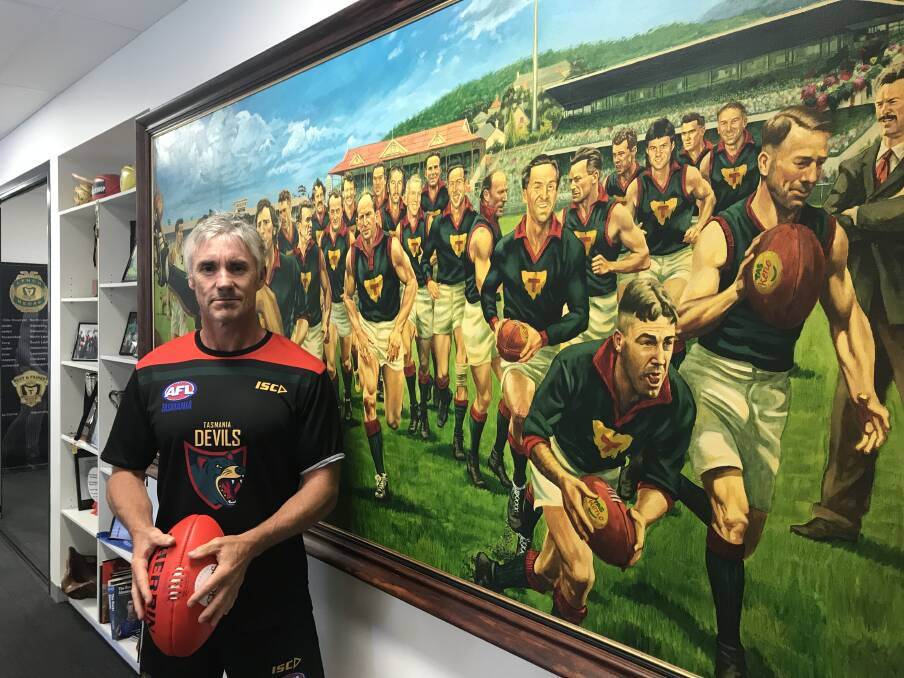 LEGACY: Former AFL veteran Adrian Fletcher takes in the state's footy past as he looks to bring Tasmania back to its best from the under-18s Devils program. Picture: AFL Tasmania