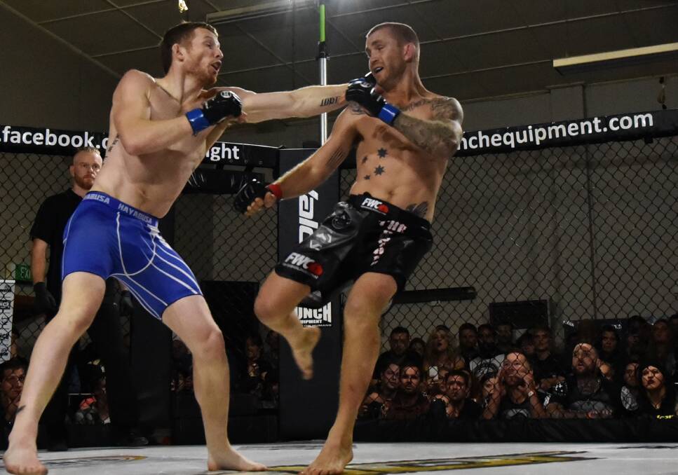LAST TIME AROUNd: Damon Upton-Greer fighting back in September in Launceston against rival David Butt in Valor's MMA main event. Picture: Scott Gelston