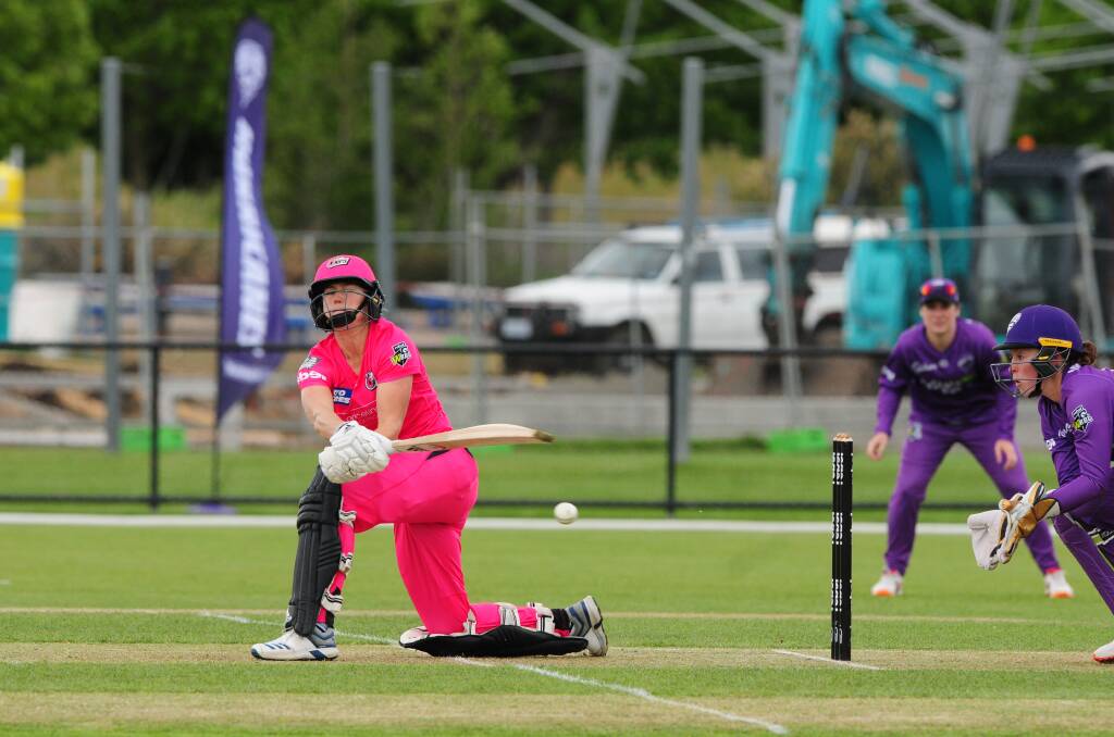 POISED: Sydney Sixers superstar Alyssa Healy attempts to play the sweep shot behind square in the WBBL encounter at Invermay Park on Wednesday. Pictures: Paul Scambler