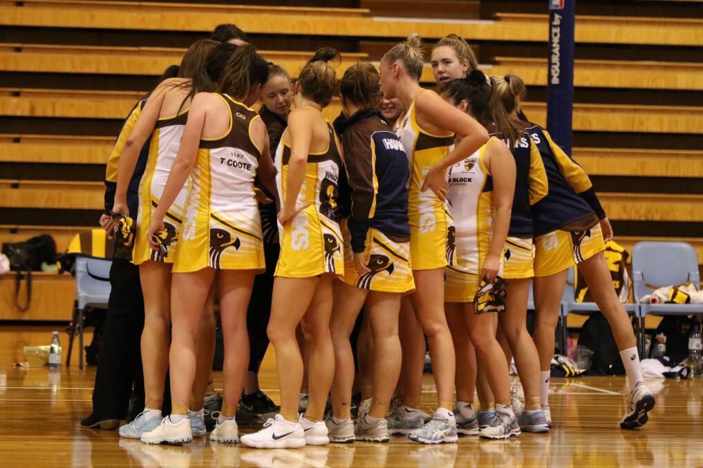 ALL FOR ONE: Northern Hawks' huddle display the closeness of teammates. Picture: Jess Stevenson
