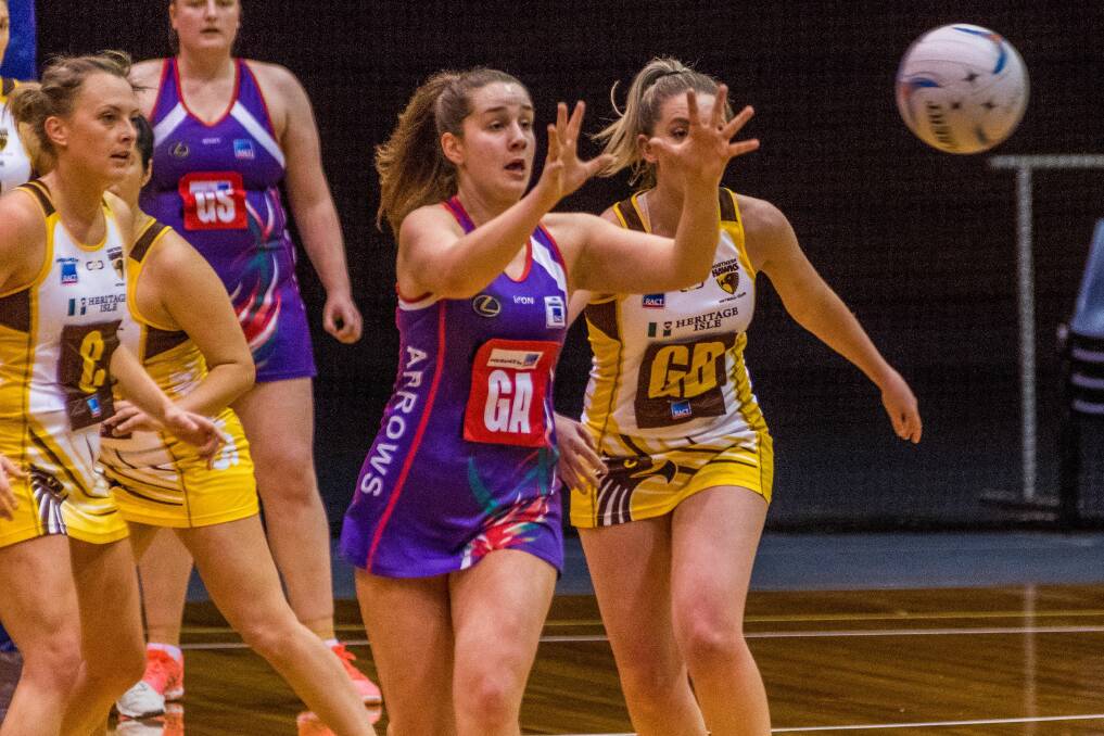 EYES UP: Arrows goal attack Natasha Shirley leads Northern Hawks defender Danielle O'Byrne to the ball in the last Silverdome encounter of the two sides. Picture: Phillip Biggs