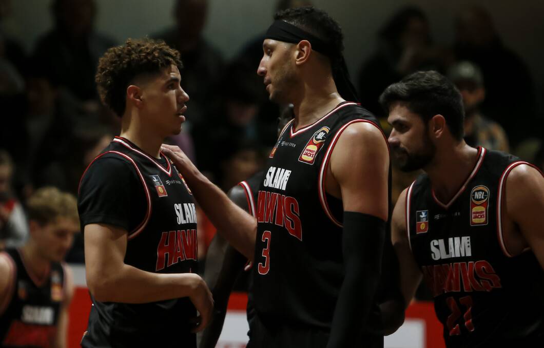 WORD UP: Illawarra Hawks NBA prospect LaMelo Ball listens to advice from NBL championship winner Josh Boone on the court. Picture: Anna Warr