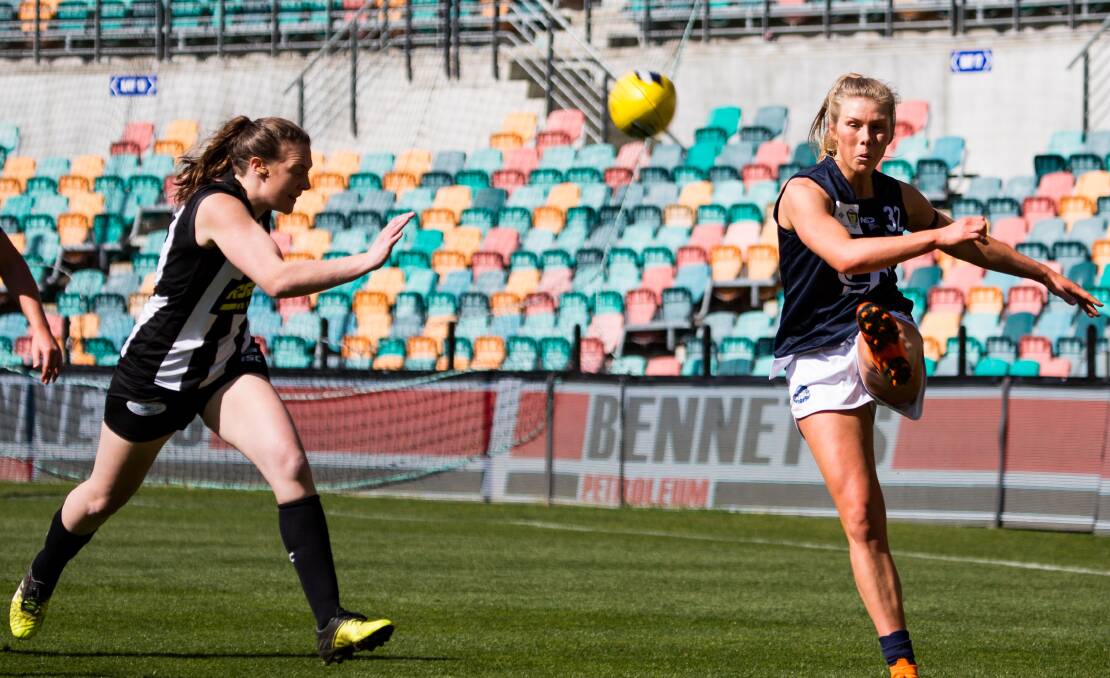 JUST IN TIME: Launceston defender Meg Sinclair gets her kick away under pressure against Glenorchy in the TSLW preliminary final on Saturday at Bellerive Oval. Pictures: Solstice Digital