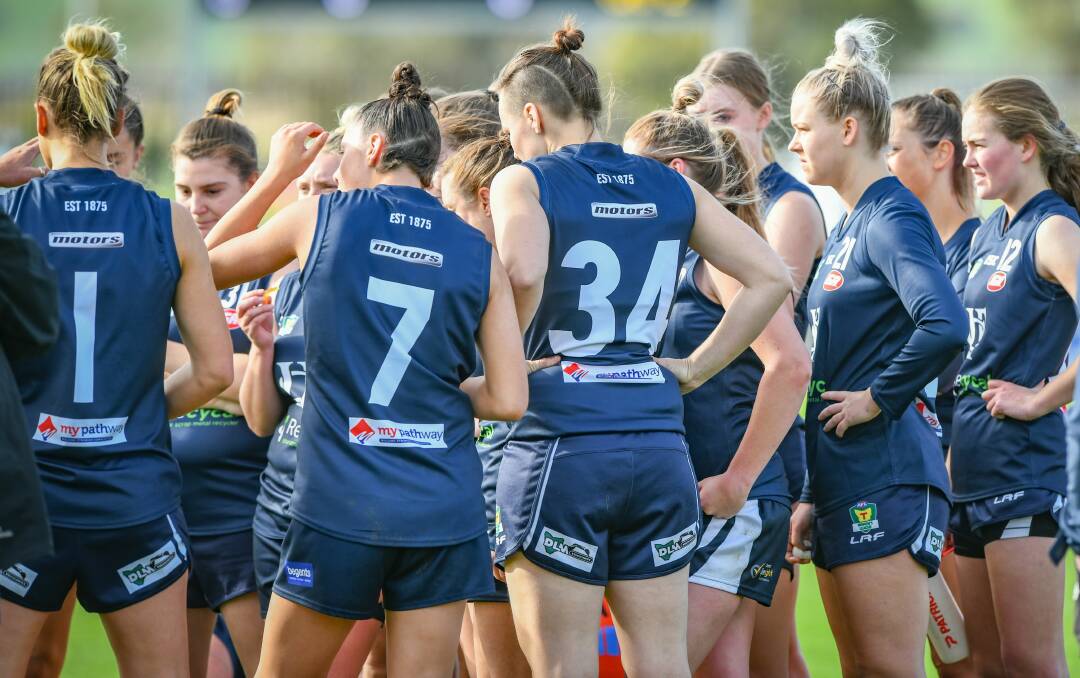 THE FUTURE: Launceston players huddle around at a break in one of the Blues' home games this year as things in the TSLW game get more serious. 