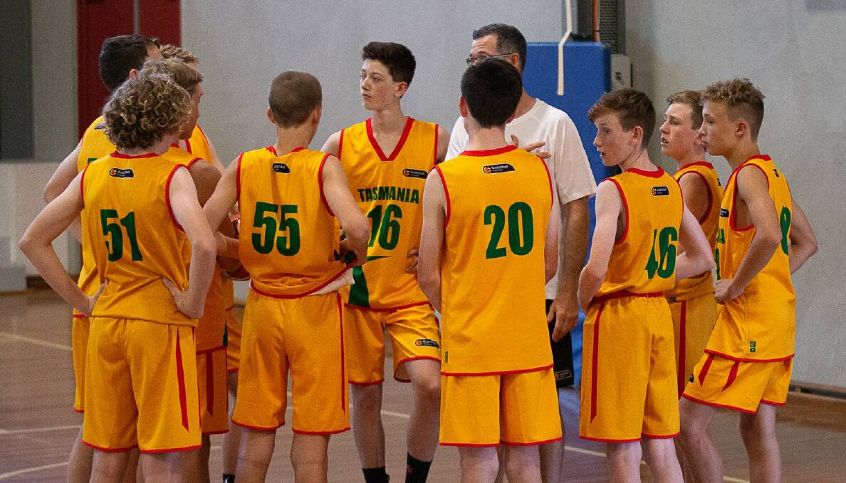 STAND TALL: Tasmania Devils prepare for their next under-16s match at the Australian Country Junior Basketball Cup in Albury last week. Picture: Ange Savage