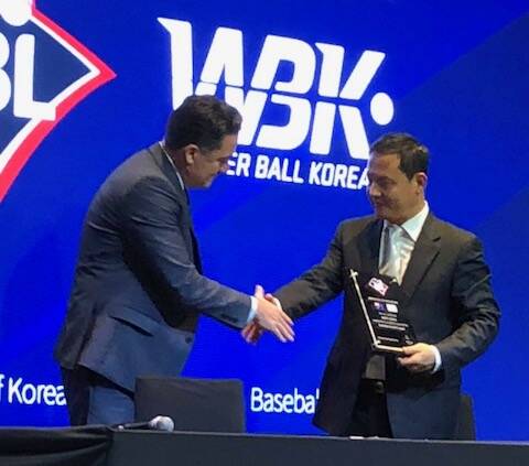 Baseball Australia chief executive Cam Vale signing a deal with Korean winterball.