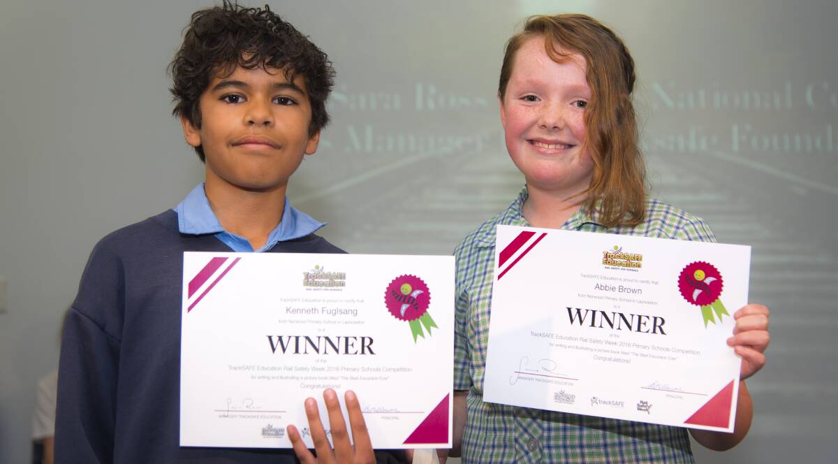 STATE PRIDE: Norwood Primary students Kenneth Fugisang and Abbie Brown present their rail safety certificates that were won in a RailSafe national competition.