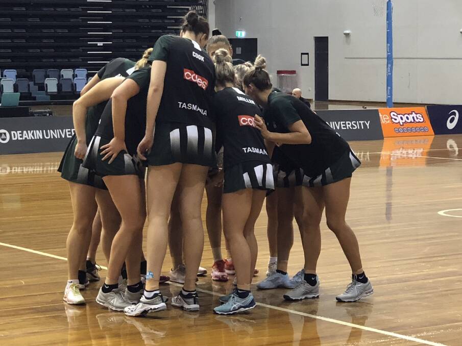 PEP TALK: Tasmanian Magpies take the court before their cutthroat semi-final against NSW Waratahs. Picture: Magpies Netball