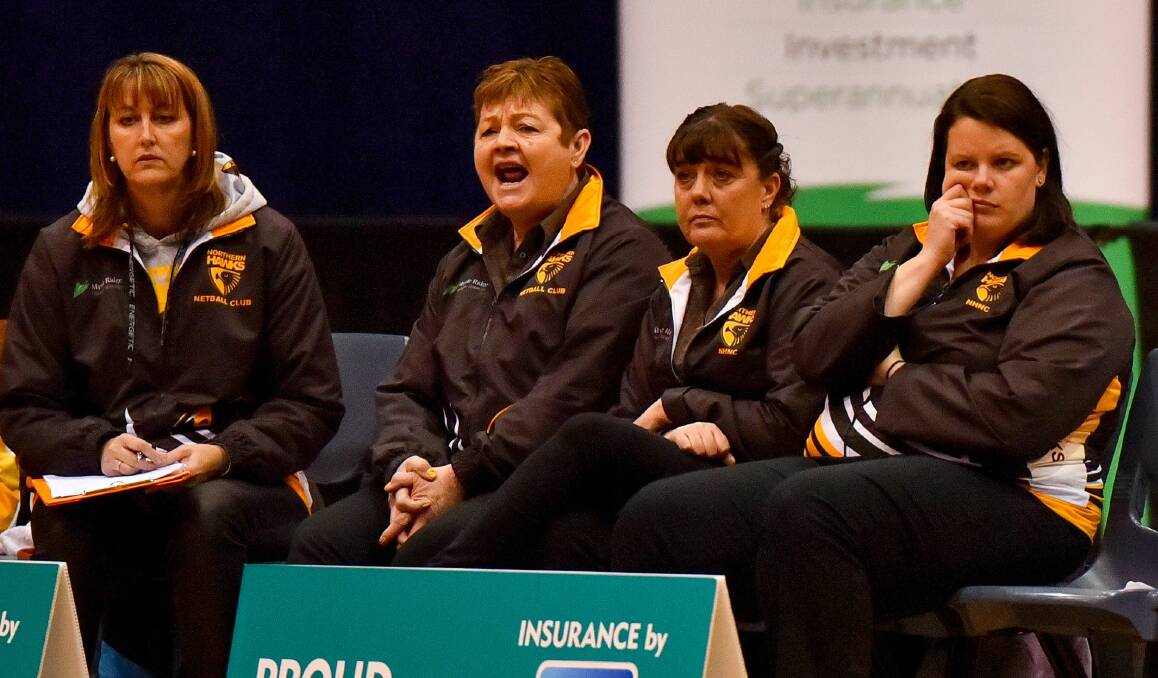 GO HAWKS: Ann Pearce, second from left, on the bench next to manager Lynne Pickett, assistant Kellie Woolnough and coach Ruth Tuohy, yells out support to Northern Hawks in last year's grand final against Arrows. 