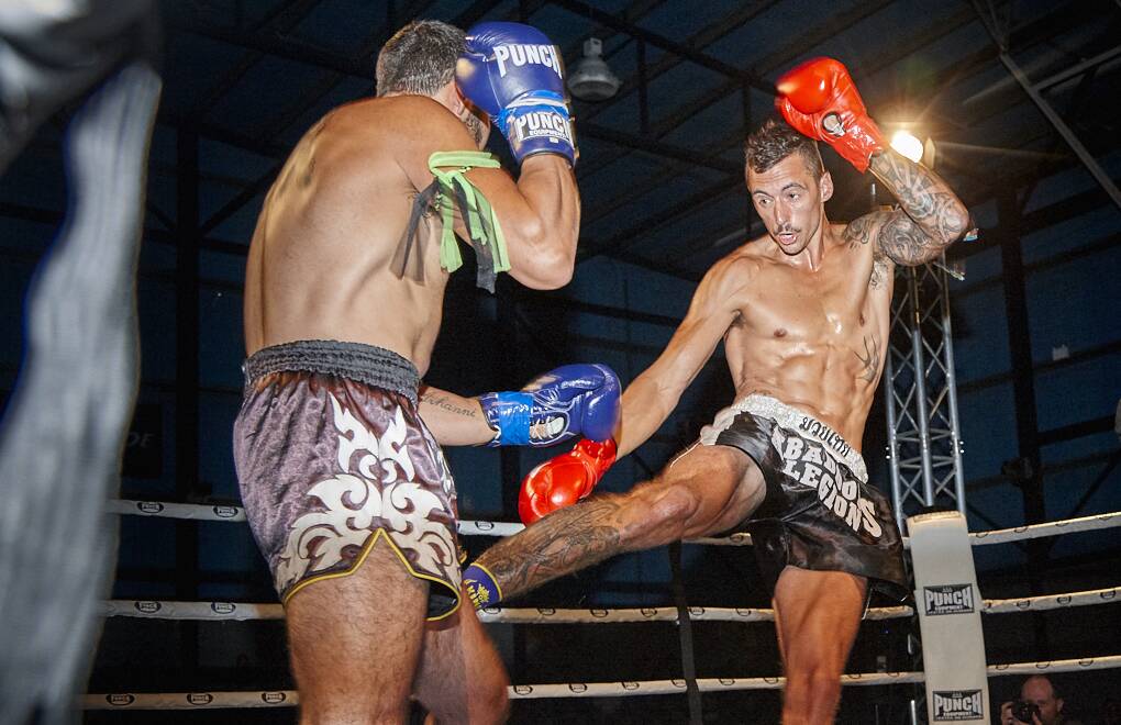 COP THAT: Cody Thorp delivers a blow to Shaun Vella in one of two bouts between rival Launceston fighters at Saturday night's Legion Muay Thai event. Picture: Dave Groves