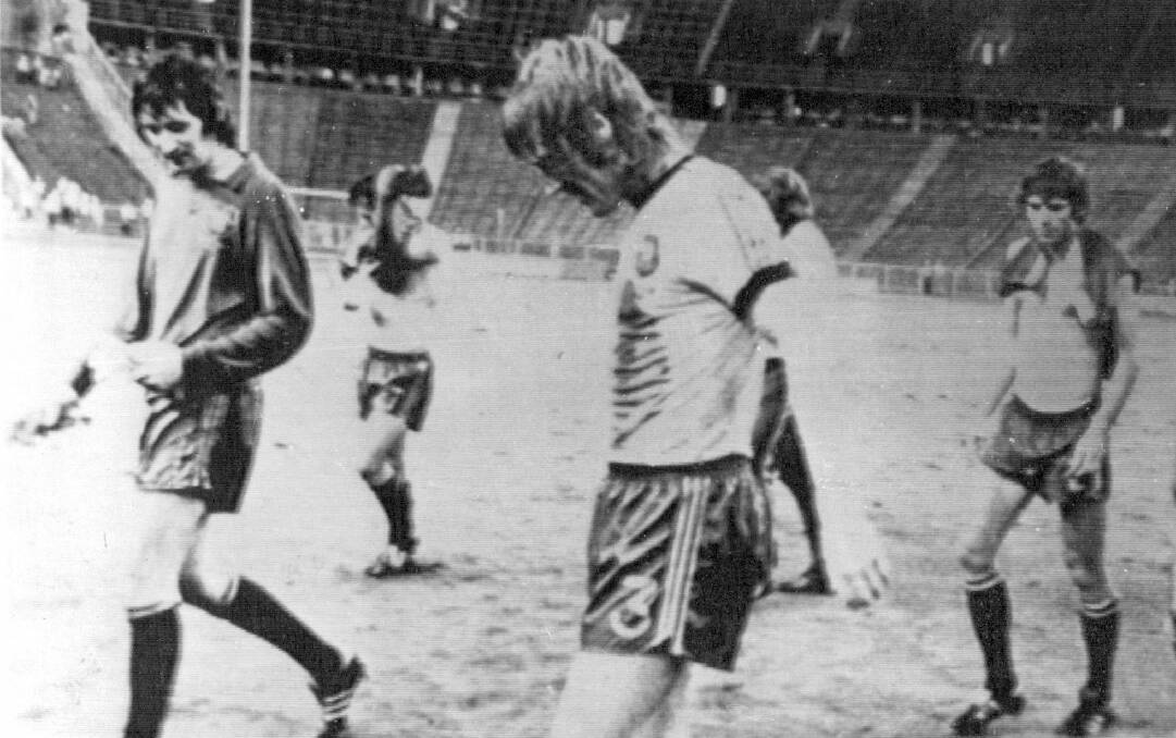DISAPPOINTMENT: Reilly leads off teammates after the side's scoreless draw with Chile, ensuring Australia failed to reach the next round of the 1974 World Cup. Picture: UPI