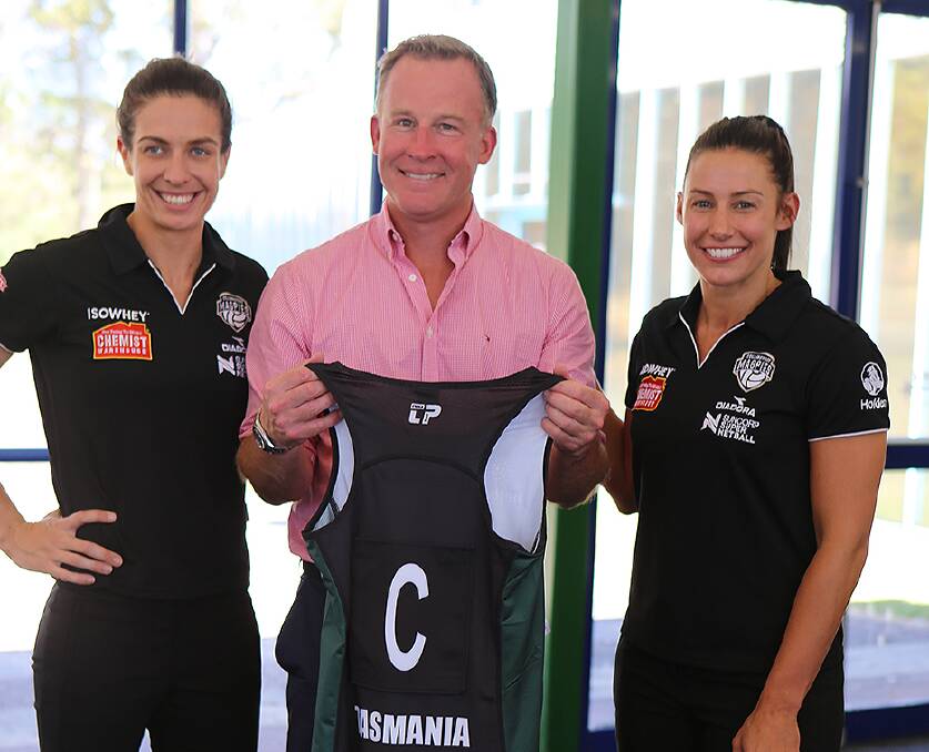 AND NOW: Collingwood netballer Madi Robinson is joined by teammate Ash Brazill and Tasmanian premier Will Hodgman at the Magpies official Silverdome launch.