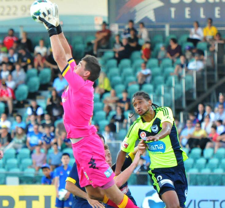 SAFE HANDS: Mat Ryan up against Melbourne Victory in 2013 at UTAS Stadium. 