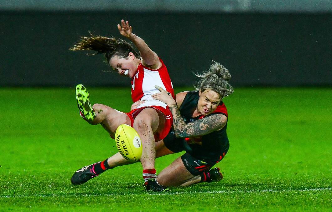 COP THAT: North Launceston's Letitia Hancock lays a tackle on Clarence's Rachel Archer in their TSLW clash at UTAS Stadium. Pictures: Scott Gelston