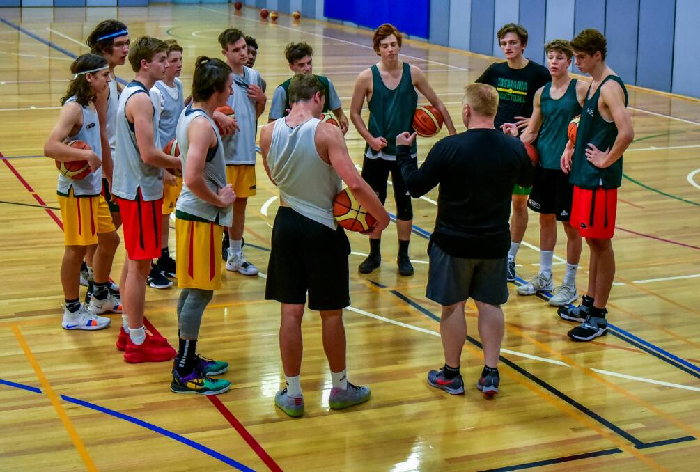 LISTEN UP: Coach Mark Radford addresses the Tasmanian under-18 boys at their first practice in Deloraine for the nationals. Pictures: Neil Richardson
