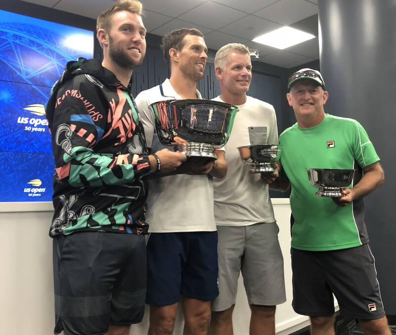 HAPPY PARTNERSHIP: US Open doubles champions Jack Sock and Mike Bryan, with their respective coaches, Mark Knowles and David Macpherson. 