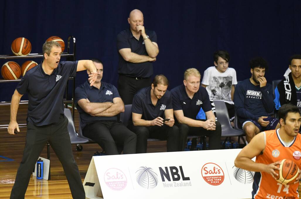 FULL ON: Southern Huskies coach Anthony Stewart demonstrates his emotions off the bench in Sunday's tough loss to Southland Sharks at the Silverdome. Picture: Paul Scambler