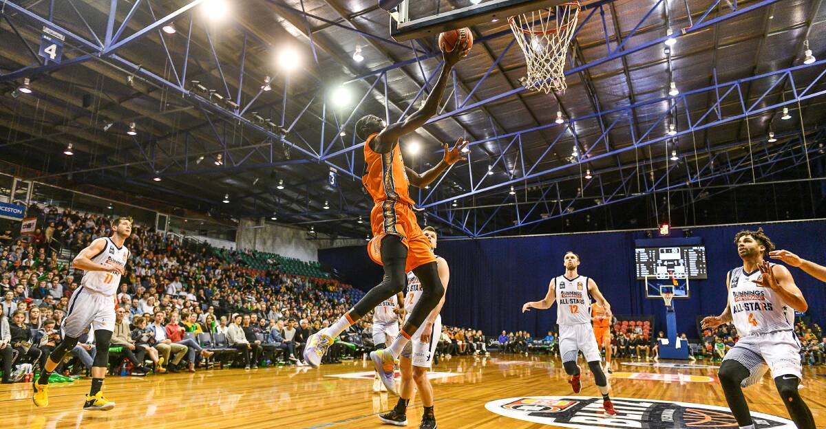 LEAPER: Cairns Taipans forward Majok Deng flies high to the hoop at the Silverdome.