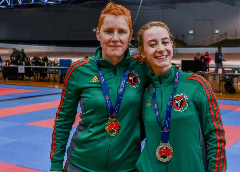 HOME GLORY: T'Meika Knapp and Annalise Beechey share in the medals for Tasmania at the Australian Karate Federation national championships. Pictures: Neil Richardson