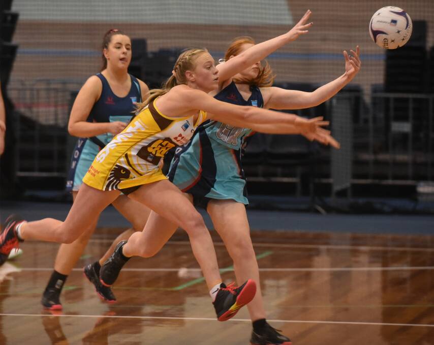FIERCE: Northern Hawks newcomer Hannah Lenthall strives for the ball in a contest last weekend in the tremendous win over Devon. Picture: Paul Scambler