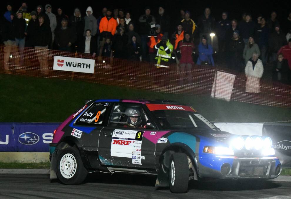 BRIGHT LIGHTS: Tim Auty spins his wheels for the crowd on Friday night at the Inveresk Super Special on the eve of winning the Rally Tasmania third-round action. Picture: Paul Scambler