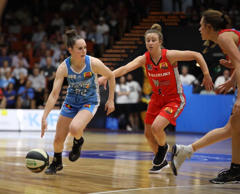 MOVING: Former Launceston Tornadoes captain Lauren Mansfield puts her skates on for Perth Lynx against Canberra Capitals. Picture: AAP