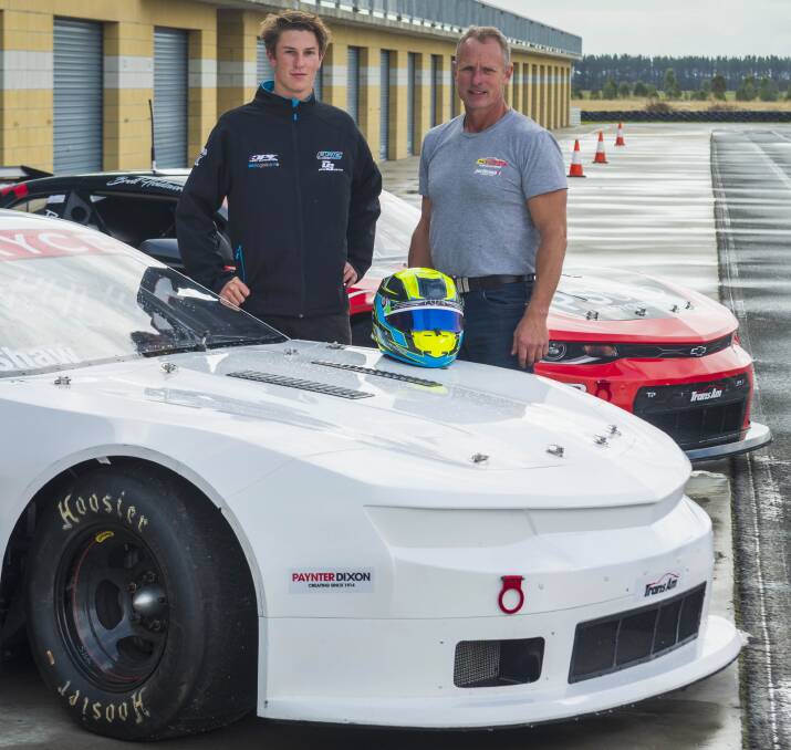 READY TO ROLL: Tassie drivers Lochie Dalton and Tim Shaw stand between their trans-am cars at the Symmons Plains on Friday.