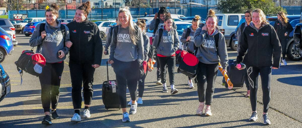 HOMECOMING: Upbeat Launceston Tornadoes players arrive back at Elphin Sports Centre on Sunday, the day after their SEABL women's grand final defeat. Picture: Neil Richardson