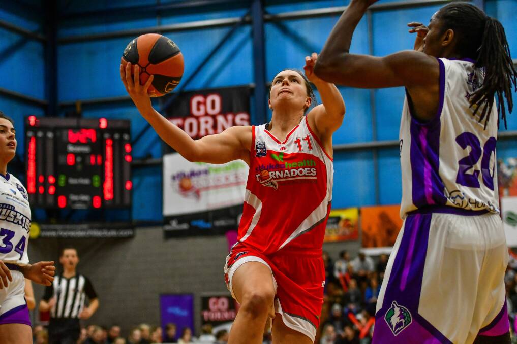 UP SHE GOES: Launceston Tornadoes import Stella Beck looks to drive to the basket. Pictures: Scott Gelston