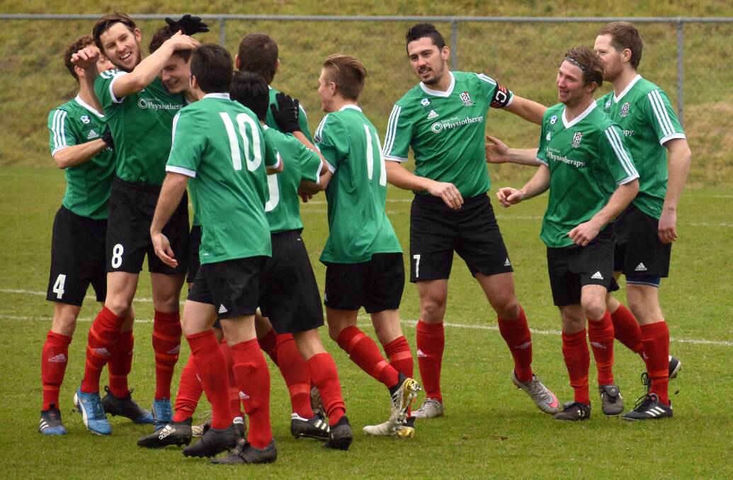 ON A ROLL: Launceston City come together in a goal celebration last week at Kingborough to continue consecutive wins. Picture: Walter Pless