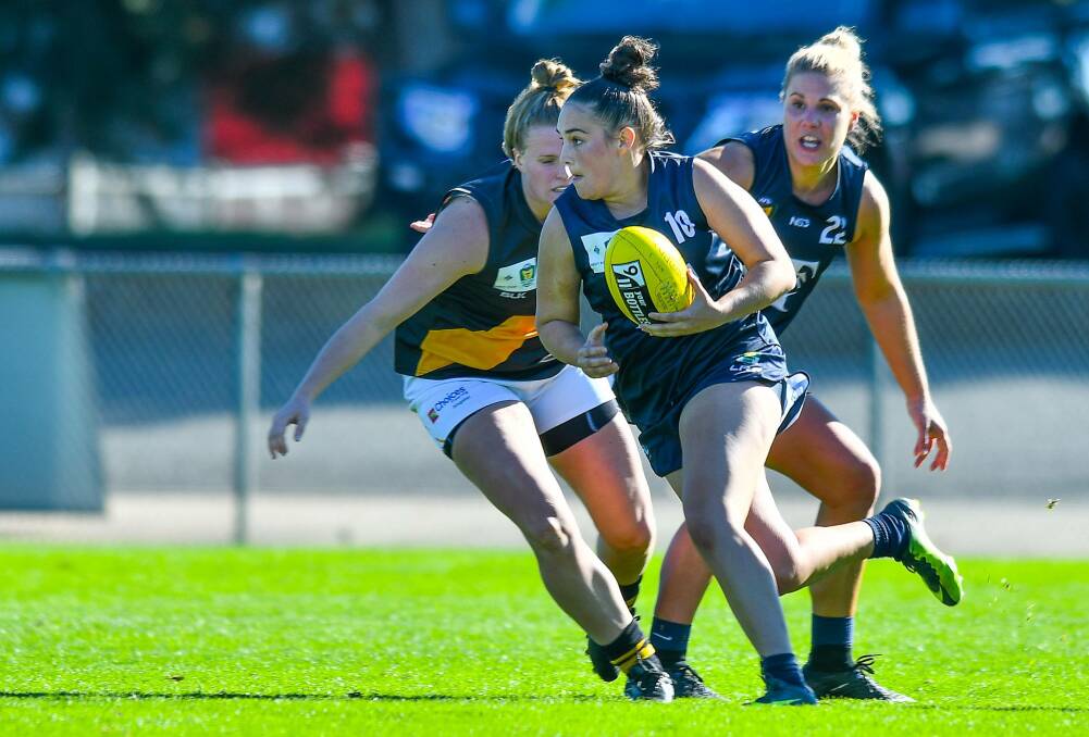 ON THE CHARGE: Launceston talent Danika Corcoran looks to break away during last week's TSLW clash against the Tigers at Windsor Park. Picture: Scott Gelston.