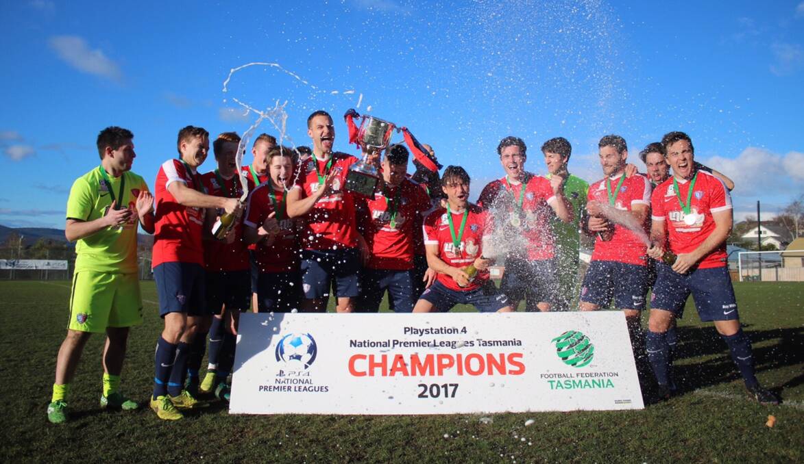 WE ARE THE CHAMPIONS: South Hobart go into party mode following their huge win over Launceston City during the presentation of the National Premier Leagues Tasmania trophy on Saturday. Picture: Solstice Digital