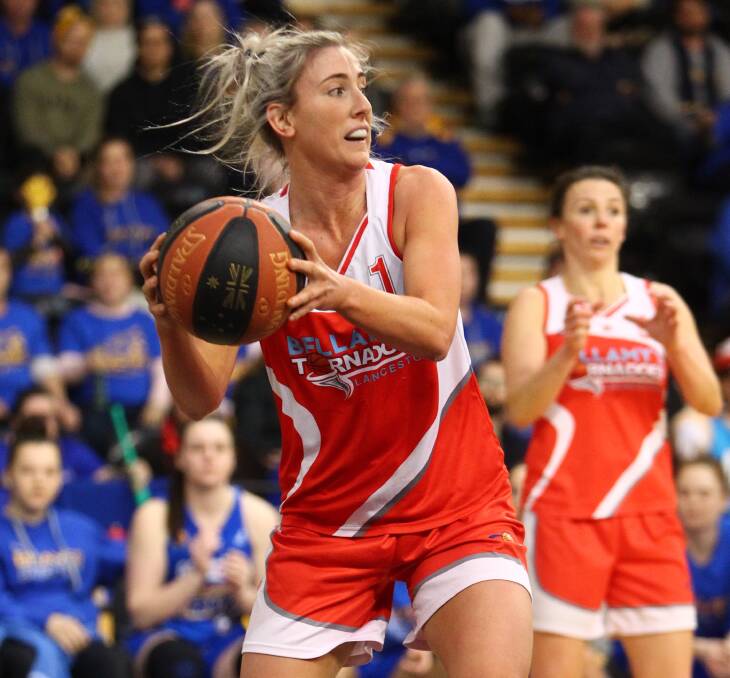 WORKHORSE: Launceston Tornadoes star Lauren Nicholson looks to pass the ball off during Saturday night's epic SEABL women's grand final clash with Bendigo Braves at Melbourne's State Basketball Centre. Picture: Ian Knight