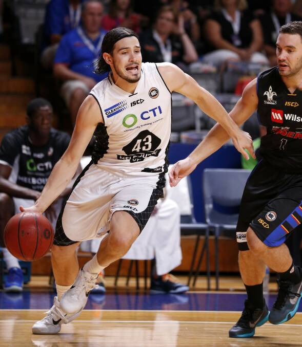 WRONG MOVES: Melbourne United champion Chris Goulding looks to evade Adam Gibson amid a one-on-one battle between the Launceston-born talents. Picture: NBL