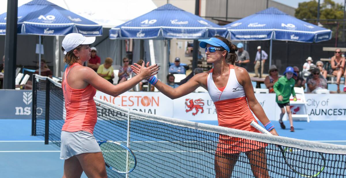 SHAKE ON IT: Irina Khromacheva and Arina Rodionova finish the Launceston International semi-final battle on centre court.