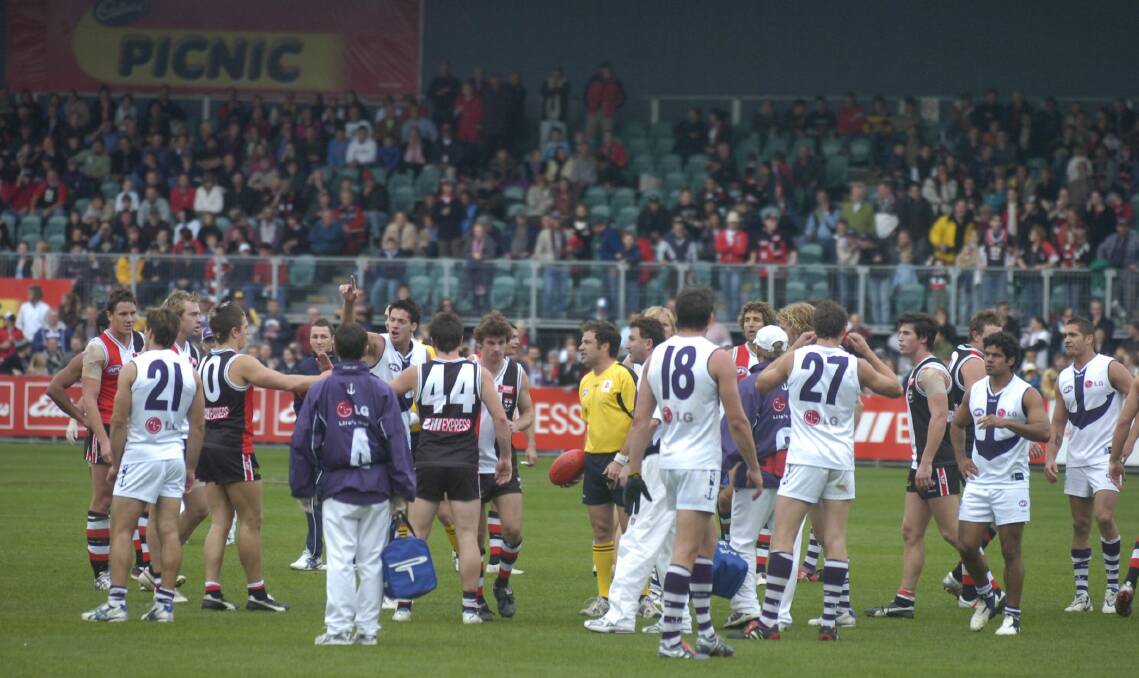 PANDEMONIUM: St Kilda and Fremantle players remonstrate over debate of the siren sounding a decade ago this week. The controlling umpire hadn't heard it and looked to continue the match at Aurora Stadium. 