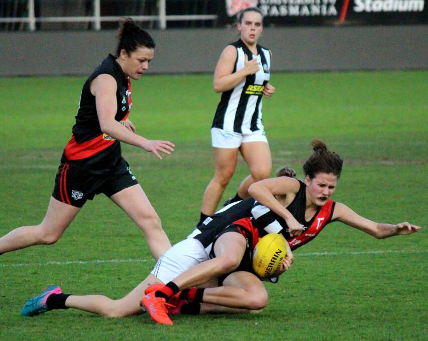 COP THAT: North Launceston's Carly Farrow feels the impact from a Glenorchy tackle. Picture: Hamish Geale