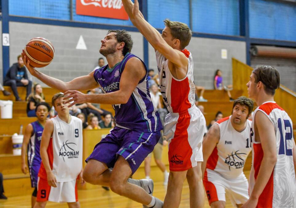 TO THE HOOP: Somerset's Jamie Mesman drives into the Moonah defence during the State League basketball semi-final clash at Elphin Sports Centre. Pictures: Scott Gelston