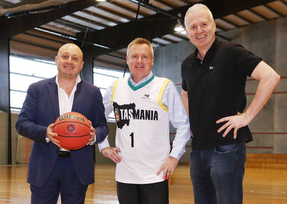 DEAL: NBL boss Larry Kestelman, Tasmanian Minister for Sport Jeremy Rockliff and NBL icon Andrew Gaze celebrate the annoucement. Picture: NBL