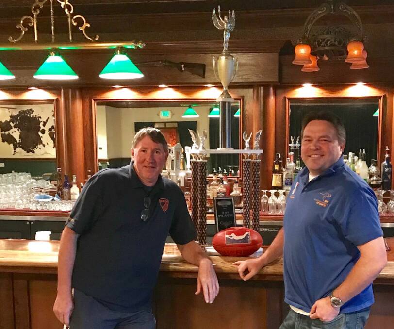 Barnes shows off Golden Gate's winning trophy after the 2018 US western regionals with former president Luke Quirk at the San Francisco league's Back Forty bar.