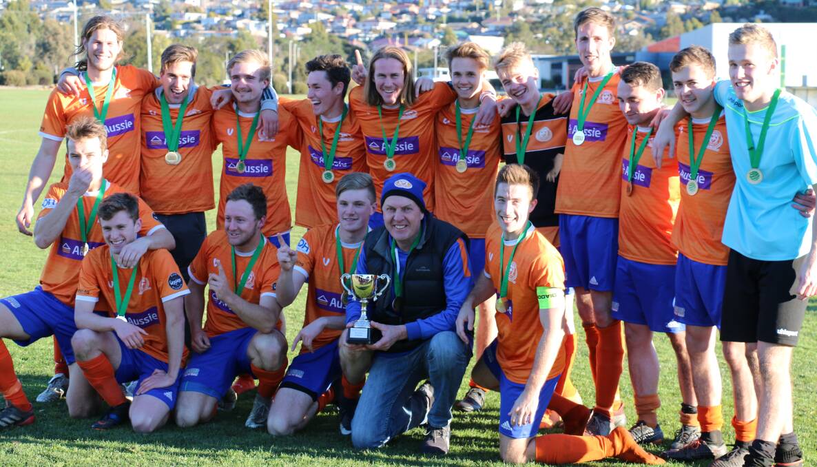 HERE IT IS: Riverside Olympic celebrate its first Northern Championship silverware since 1999. Pictures: Supplied