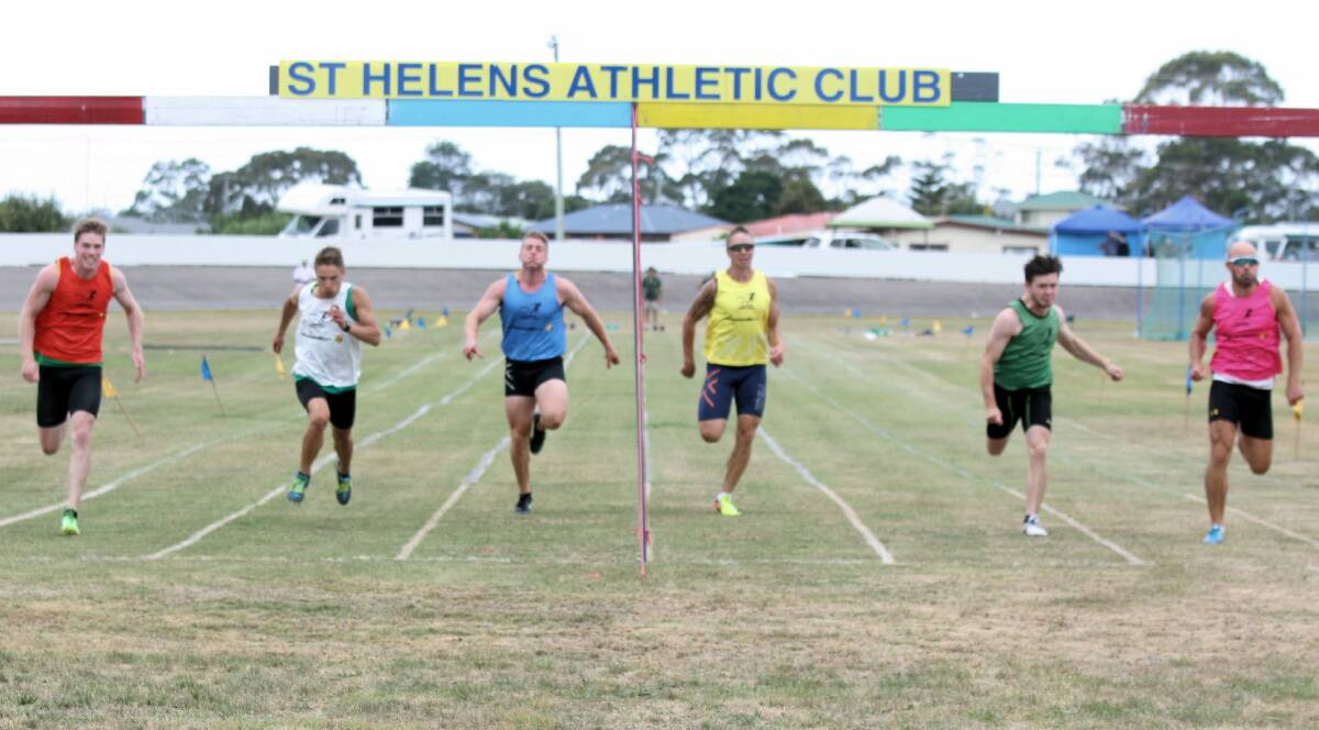 CLOSE FINISH: Mark Nicholls, in pink, manages to cross the line during the thrilling men's 120m St Helens Gift final on Saturday. Picture: Lynne Ryan