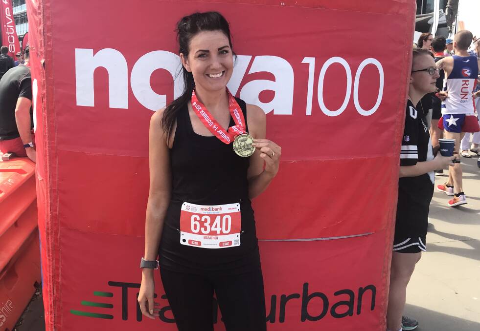 Webb shows off her Melbourne Marathon medal. Picture: Supplied