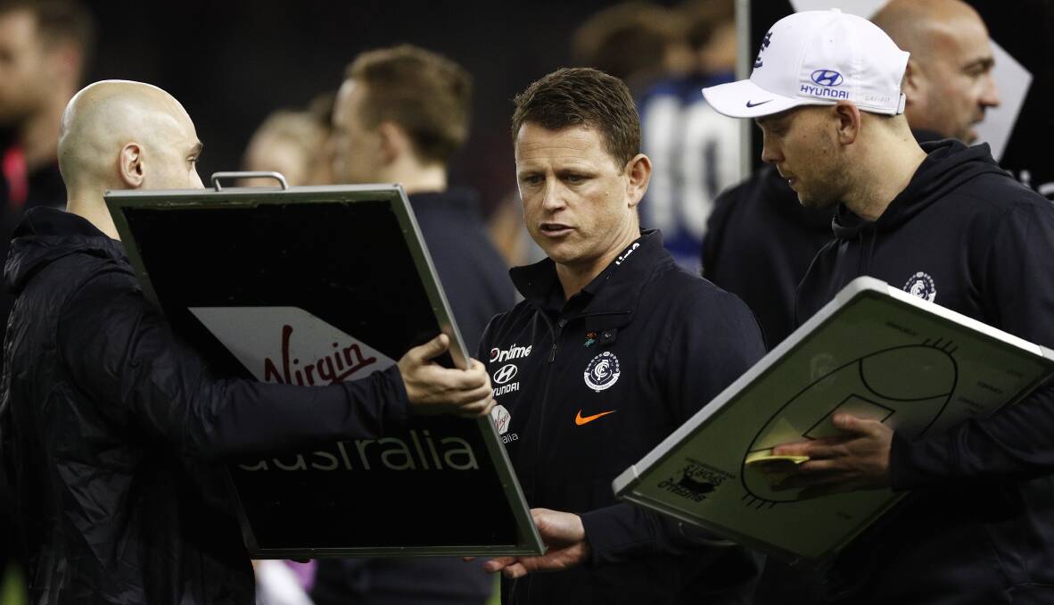 FEELING BLUE: Bolton checks the boards during a quarter-time break. Picture: AAP